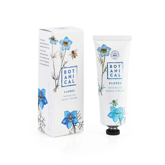A tube of Flores Intensive Hand Cream next to its packaging box, both featuring a floral design.