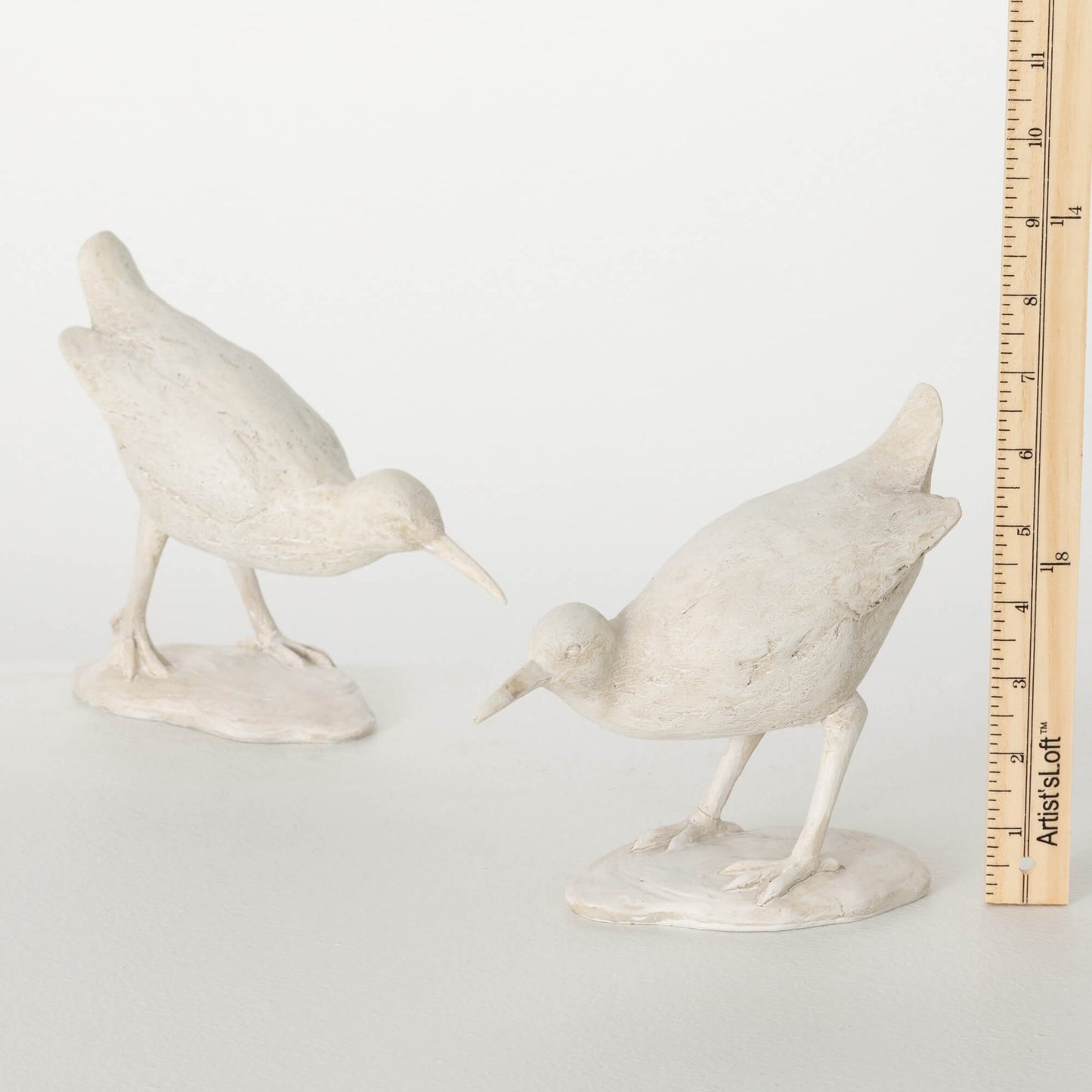 tape measure showing size of sea bird figurine