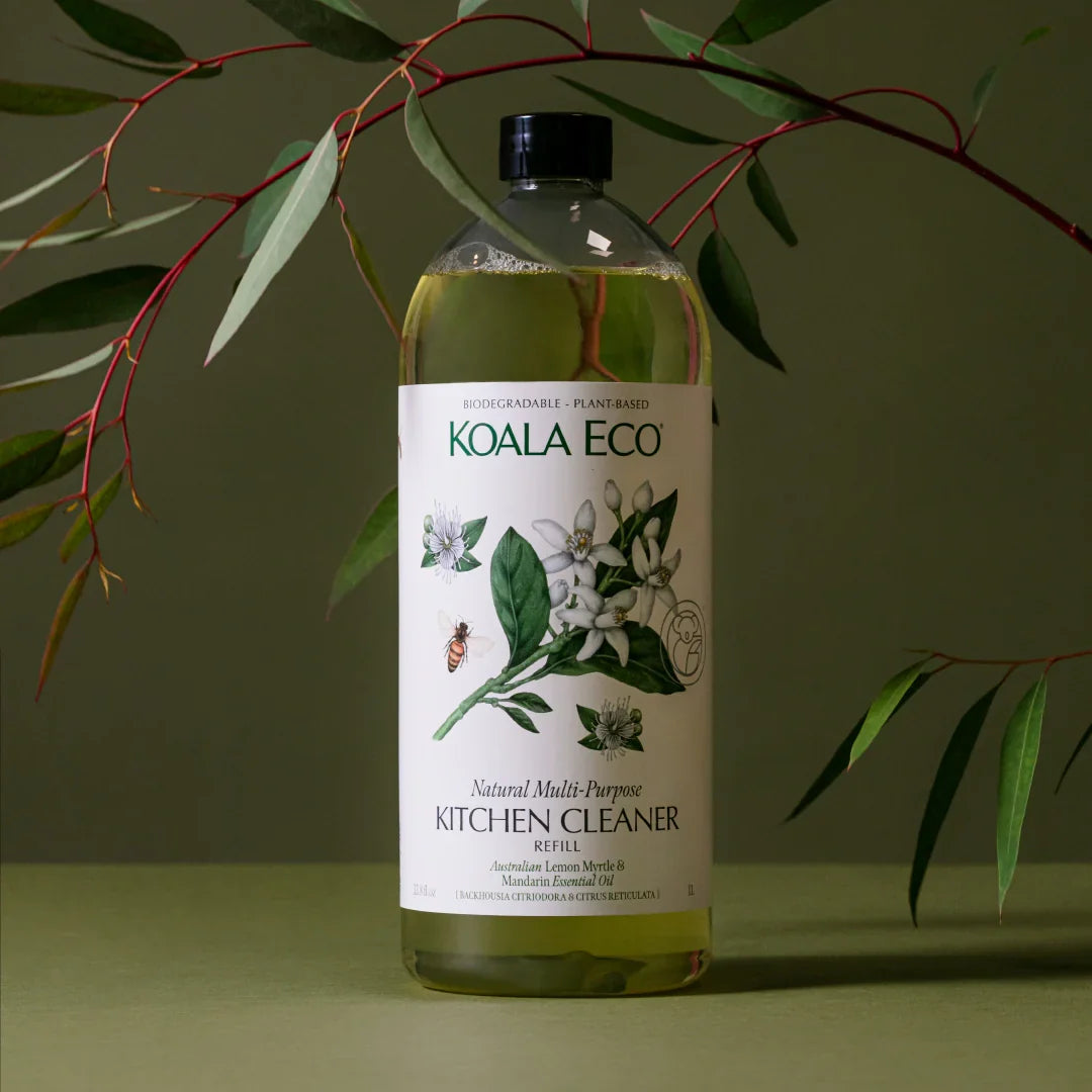 chemical free home cleaning product on green background with olive branch