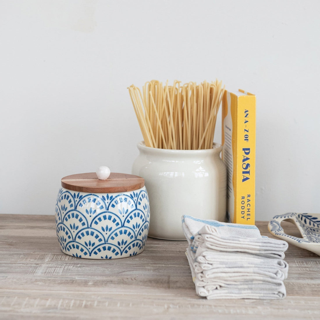 plastic free kitchen storage options shown on a counter for having a chemical free home