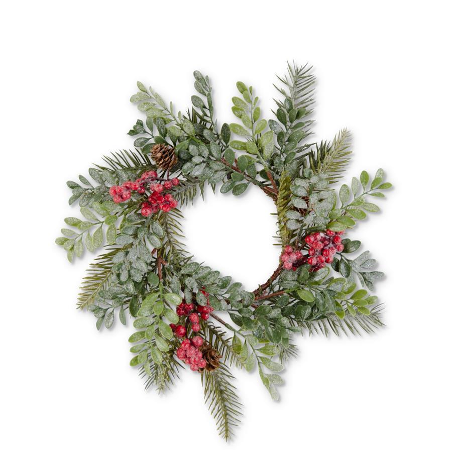 Glittered holiday wreath with green boxwood, red berries, and pinecones