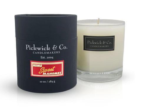 Mahomes Chiefs candle from Pickwick & Co., shows the black candle packaging and the candle itself with a clear glass and black label. 