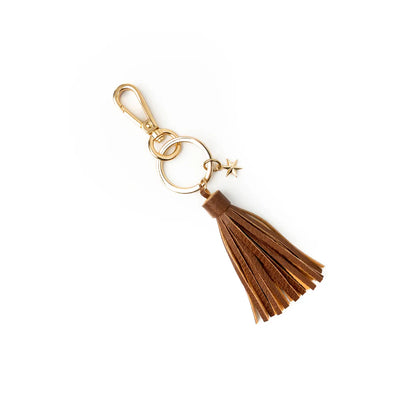 Brown tassel keychain with gold clasp on a white background