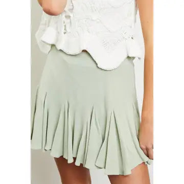 light green skort close up with white loose blouse