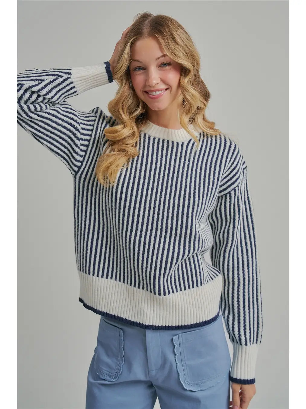 Vertical striped crewneck sweater in navy and cream knit, ribbed hem