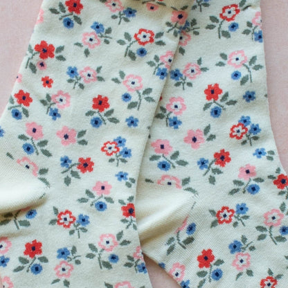 an up close image of the details of a pair of floral socks