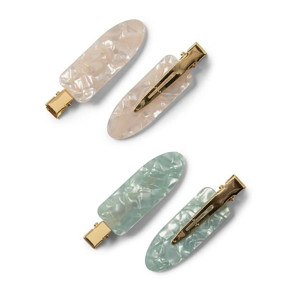 A set of four hair clips in two colors, creamy pink and soft green, with a marbled design and metallic gold clasps.