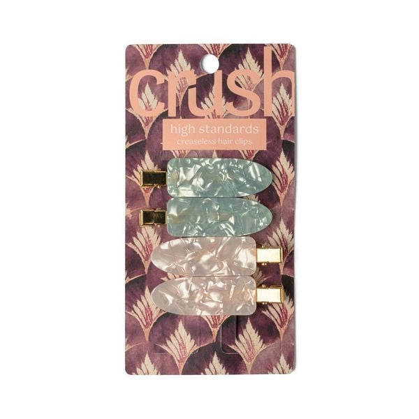 A set of four hair clips in two colors, pink and green with a marbled design and metallic gold clasps.