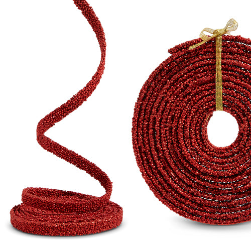 Red beaded cord with a gold bow on a white background