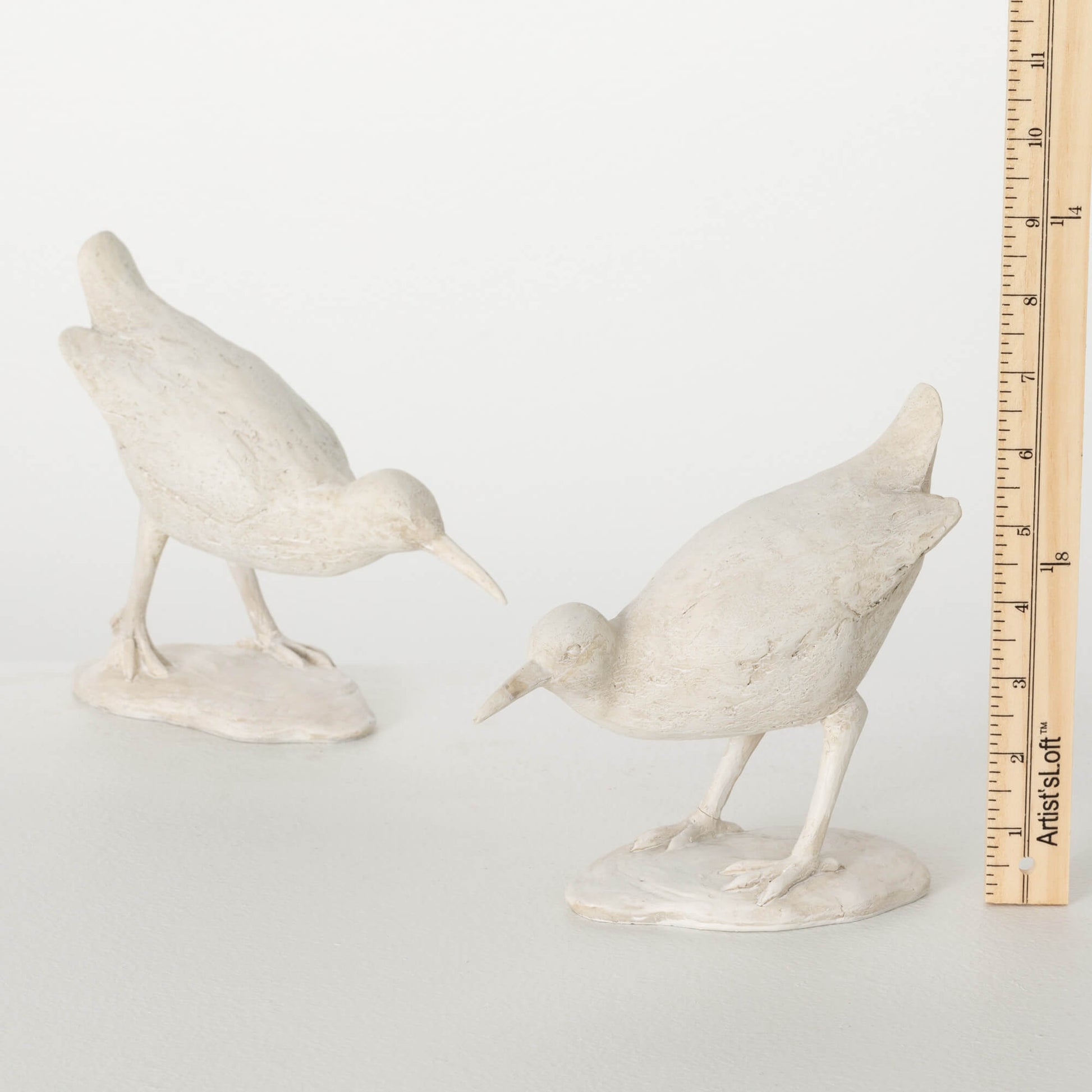 tape measure showing size of sea bird figurine 