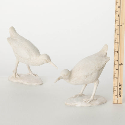 tape measure showing size of sea bird figurine 
