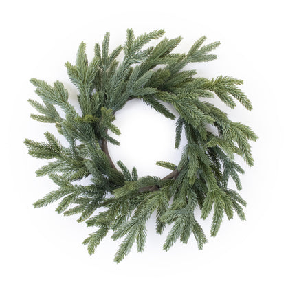 Spruce candle ring wreath made of green pine branches in a circular shape