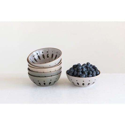 Set of ceramic bowls with blueberries on a white background