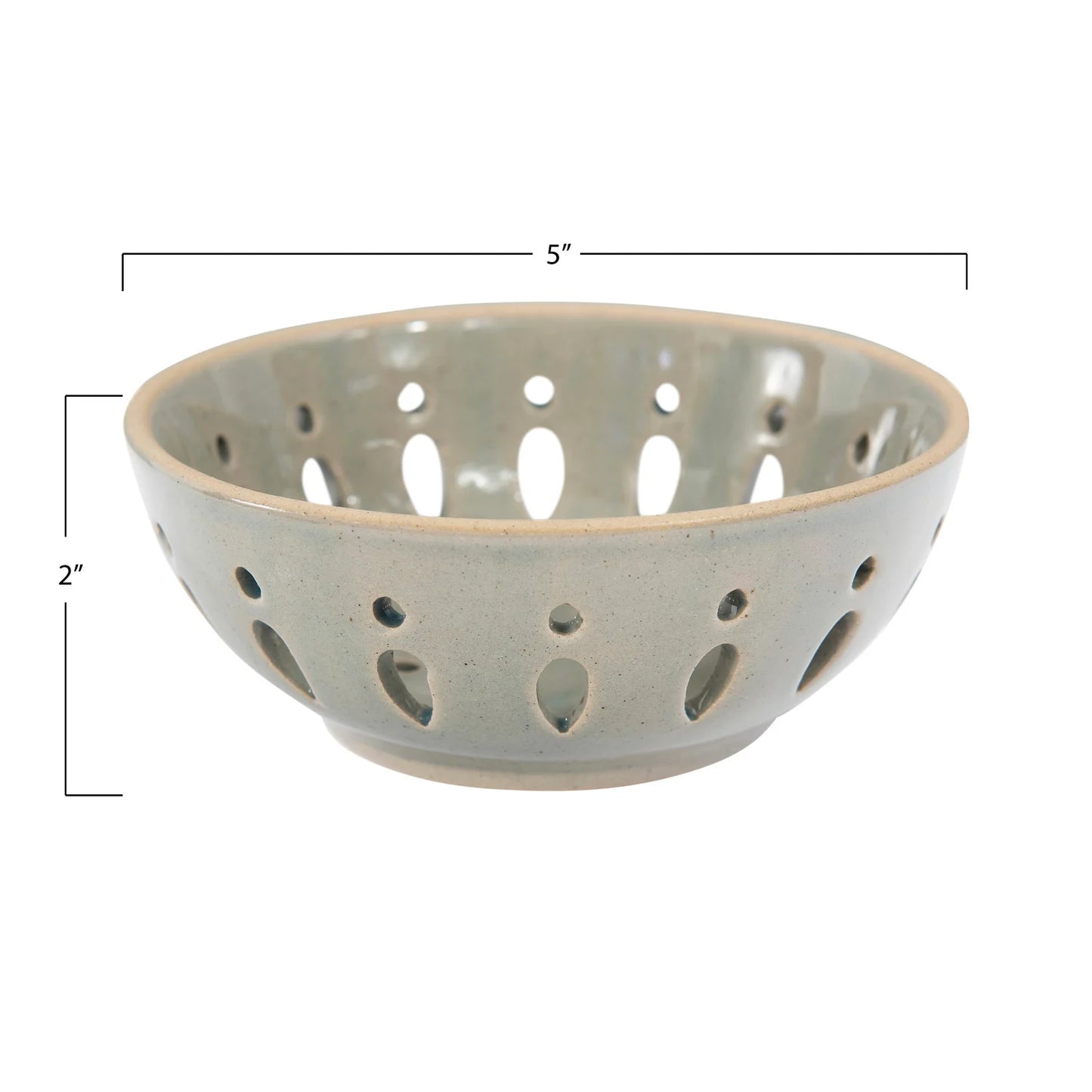 Gray ceramic bowl with perforated design on a white background