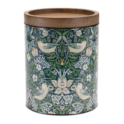  Storage canisters in varying sizes with wood lids, adorned with a green floral pattern, displayed on a kitchen counter.
