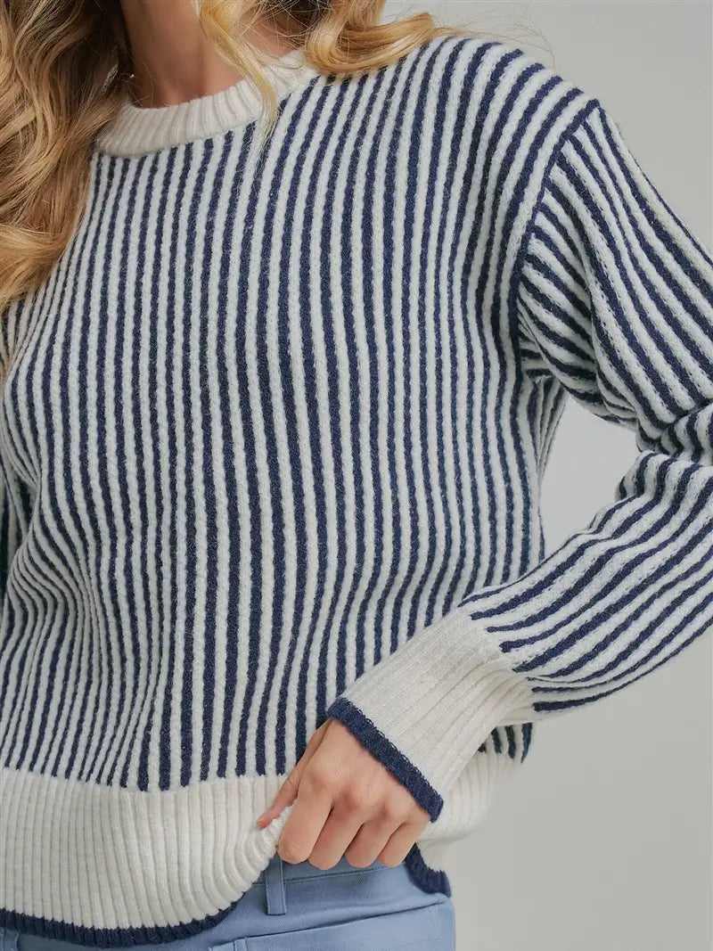 Vertical striped crewneck sweater in navy and cream knit, ribbed cuffs
