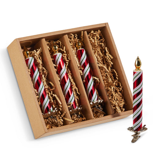 Set of candy cane-striped candles in a decorative box with gold accents.